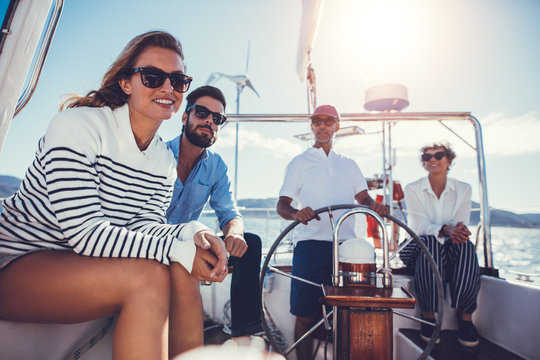 Two couples on yacht on sunny day