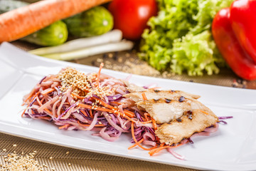 Salad with eel, carrot and red onion