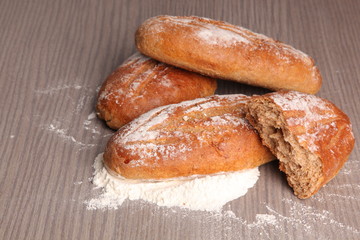 broken bread flour on gray wooden background