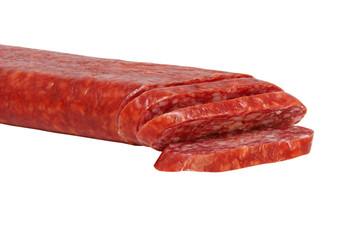 Sliced appetizing salami isolated on white background.
