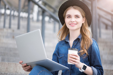 Modern young woman using technologies