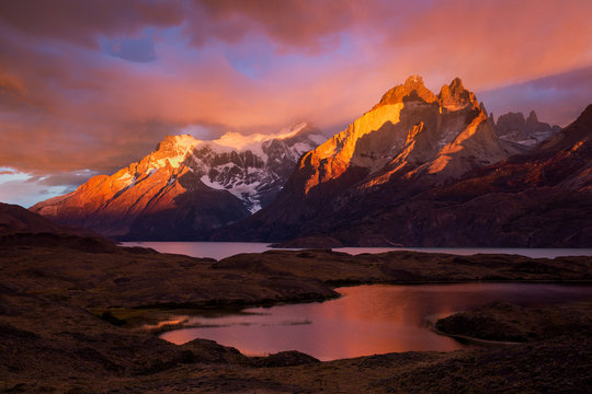 First light on the Cuernos under stormy skies