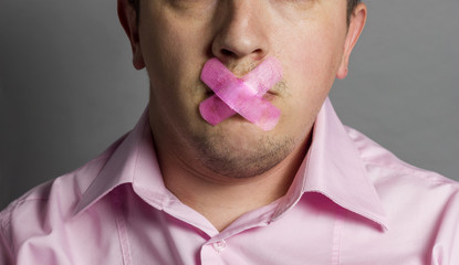 man with mouth covered by pink patch to forbidden him the free s - obrazy, fototapety, plakaty