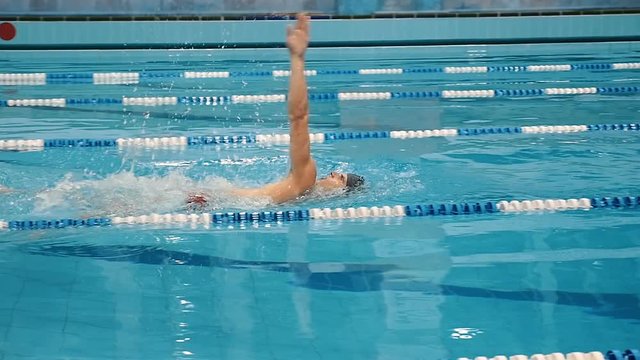 Swimmer swimming in the waterpool