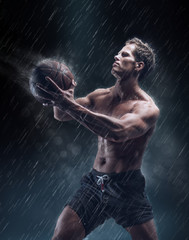 Fototapeta na wymiar Portrait of shirtless wet bascetball player.