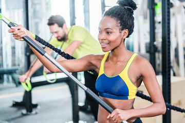 Woman and man in functional training for better fitness