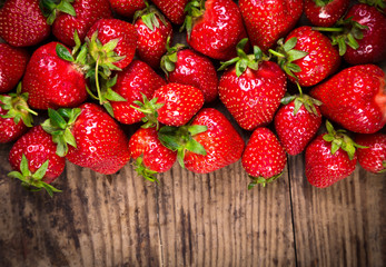 food background with strawberry on wood table
