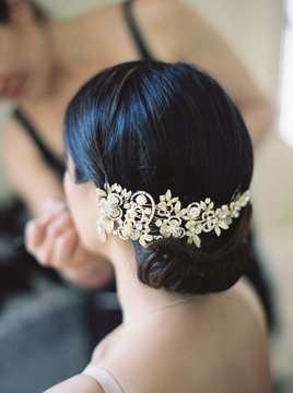 rear view of bridges hairstyle with crystal hair accessory 