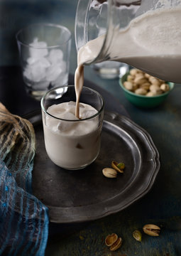 Pouring horchata into glass