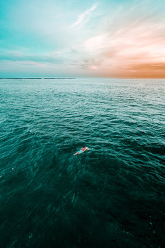Man on surfboard in ocean