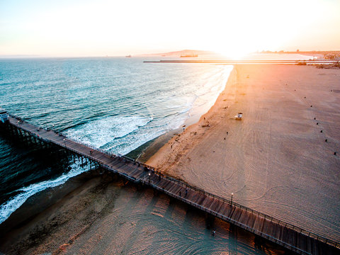 High angle view of people and pier on beach
