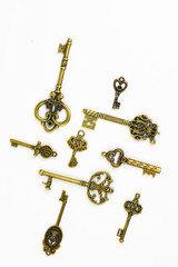 Group of Brass Antique Skeleton Keys on White Background