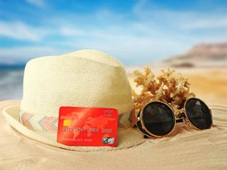 Credit card on holiday on blurred resort background