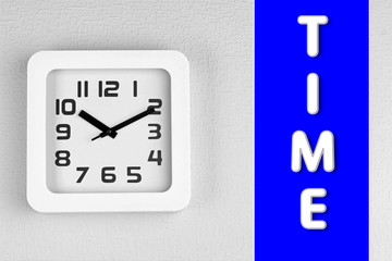 Office clock on color wall background