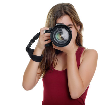 Teenager taking photographs with a professional camera