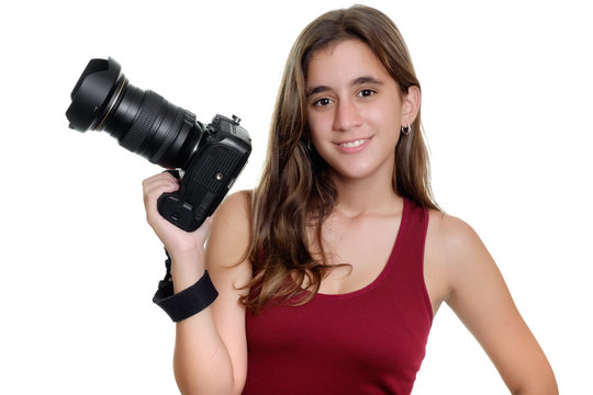 Teenage girl holding a professional camera