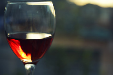 Glass of red wine on blurred background