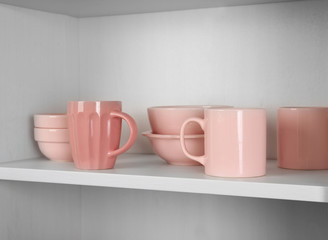 Dishes in cupboard in the kitchen