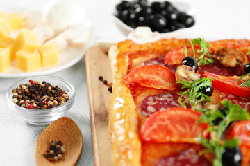 Rectangle delicious pizza on the table, close-up