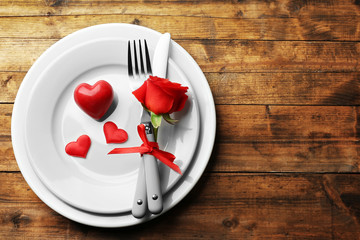 Festive table setting for Valentines Day on wooden table background