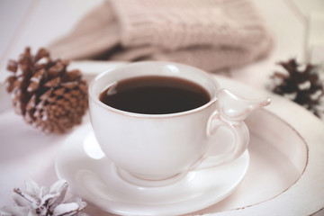 Beautiful winter composition with cup of hot drink