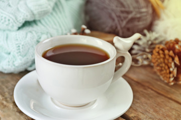 Beautiful winter composition with cup of hot drink