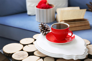 Cup of hot drink in living room. Comfortable winter weekend or holidays at home