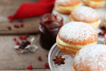 Fresh homemade donuts with powdered sugar, close up