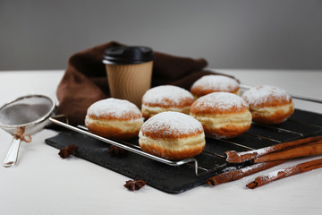 Fresh homemade donuts with powdered sugar, close up