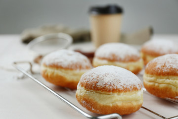 Fresh homemade donuts with powdered sugar, close up