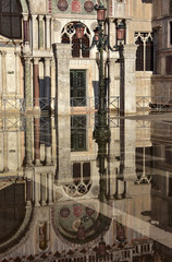 Venice Acqua Alta. Saint Mark Basilica southern facade reflection during Venice high tide, with its...
