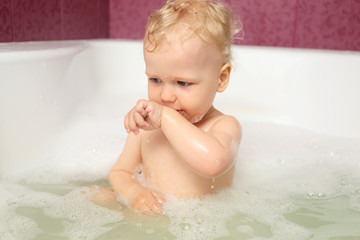 Cute baby boy in bath