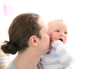 Young father having fun with his little son