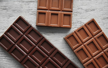 Chocolate bars  on wooden background