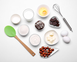 Cake ingredients on white table. Flat lay