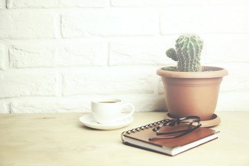 glasses  on notebook and coffee