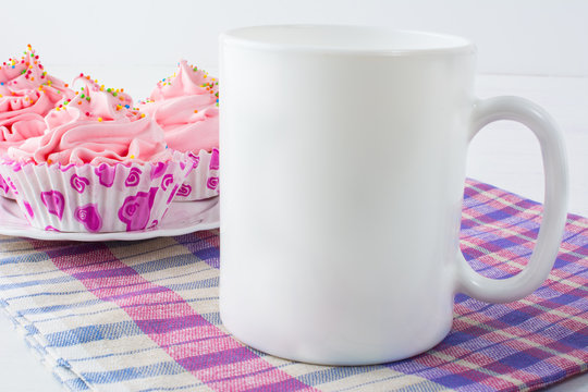 Coffee mug mockup with checkered napkin