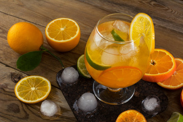 Tropical iced fruit cocktail on wooden table