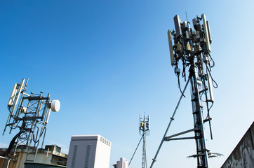 High mast metal structure telecommunication on tower with blue sky.