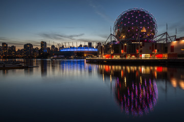 Naklejka premium View of Downtown Vancouver at Science World with the Stadium in the Background. Taken in Vancouver, British Columbia, Canada, after sunset.