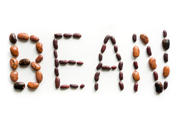 Word made of kidney beans isolated on white background. 