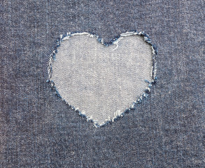 Naklejka na ściany i meble Heart shape ripped jean for Valentine's card background