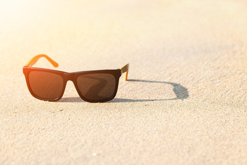 Fototapeta na wymiar Sunglasses on beach.