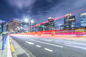 busy traffic on road in downtown of tokyo at twilight