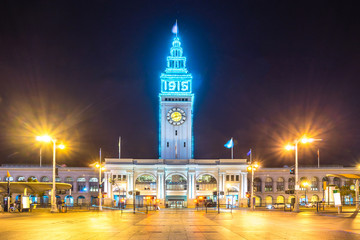 tower building with big clock at night in san francisco