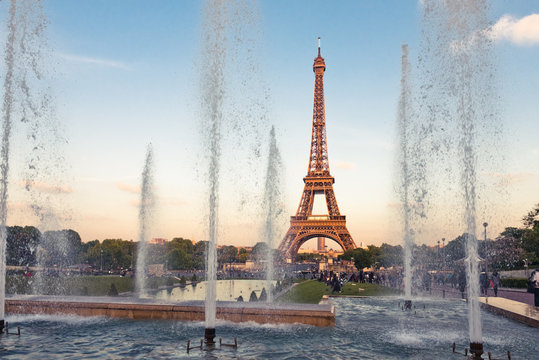 Eiffel Tower (La Tour Eiffel) with fountains. Beautiful sunset l