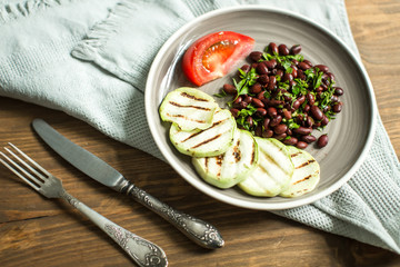 Bean lobio with zucchini on grill