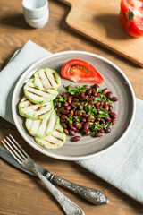 Bean lobio with zucchini on grill