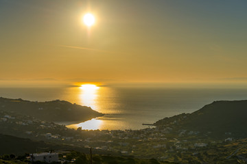 Amazing sunset in the sea. The sun falls into the Aegean sea cre