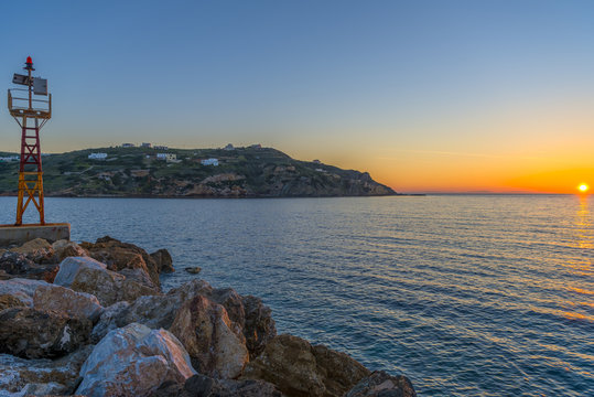 Spectacular sunset at Kini beach, Syros, Greece.